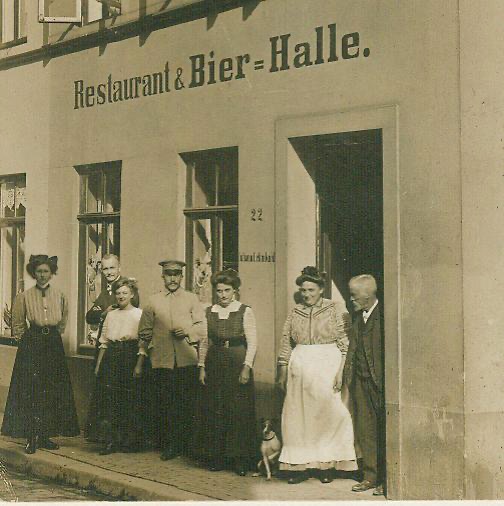 Landhaus Lehmkuhl, Werderstraße 22 in Bremen. My great-great grandfather Johann Lehmkuhl (1847-1916) on the right. His wife frau Lehmkuhl-Dohrmann in the door opening. I don't know who the rest of the people are. Probably family. 
Courtesy of Thomas Häfker for the picture.